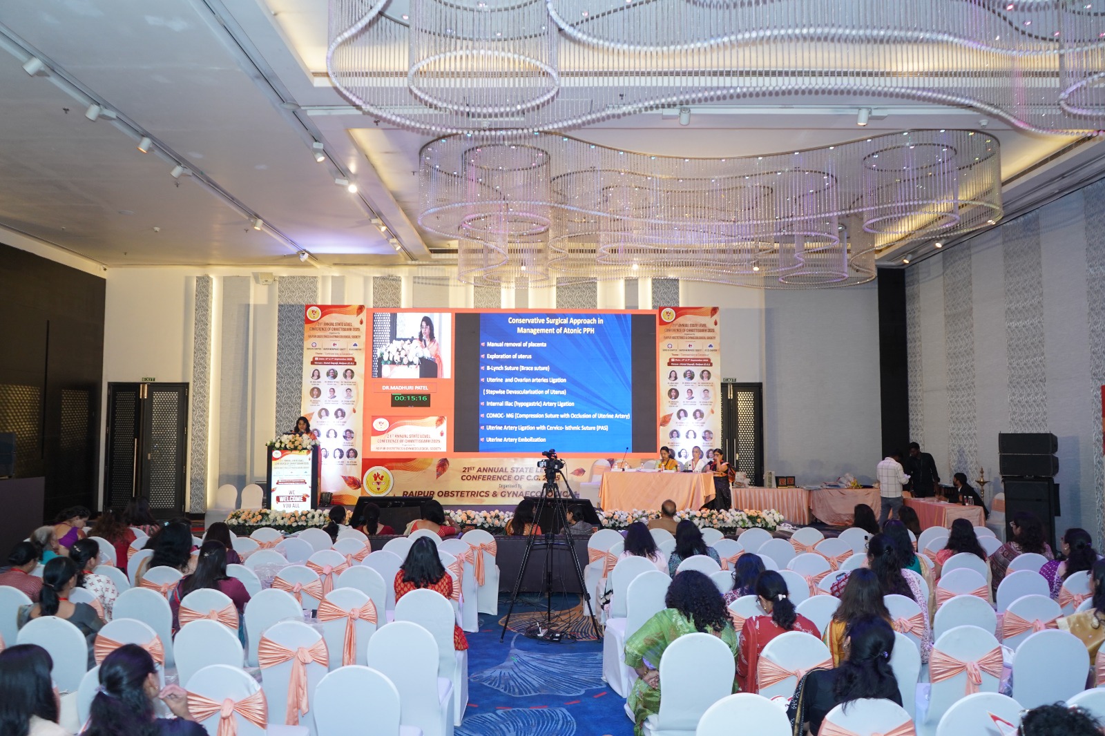 Large conference hall with LED wall and audience